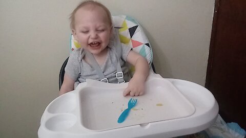 Baby laughs hysterically at fork