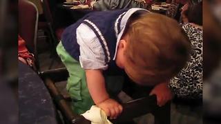 "Baby Boy Dances in His High Chair at Wedding Reception"