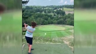 4-year-old boy tees up a hole-in-one