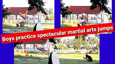 Young practice spectacular martial arts jumps