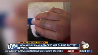 Woman says man attacked her during protest