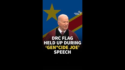 DRC FLAG HELD UP DURING ‘GEN*CIDE JOE’ SPEECH