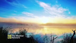 Watch this spectacular sunrise over a serene lake