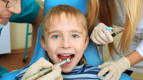 4 year old's first teeth cleaning at dentist.