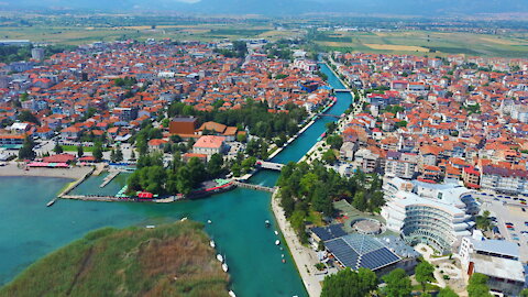 Flying above the lake and the river Crn drim in Struga
