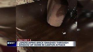 Large landscaping brick thrown through living room window narrowly misses Canton man