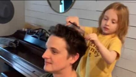 Dad lets daughter cut his hair