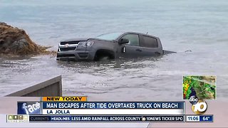Man escapes after tide overtakes truck