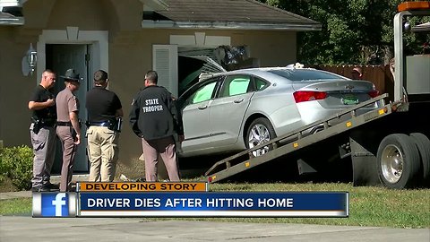 Driver dies after car crashes into Spring Hill home