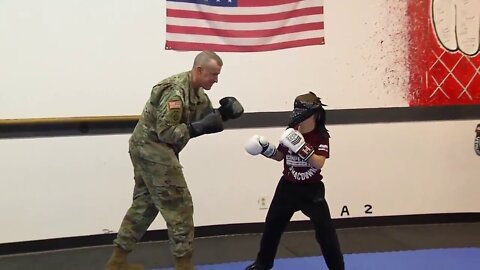Military father comes home from deployment. Surprises his son during a boxing lesson.