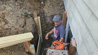 Finishing up the egress and retaining wall