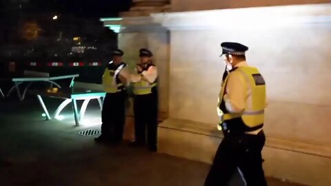 protesers climb marble arch