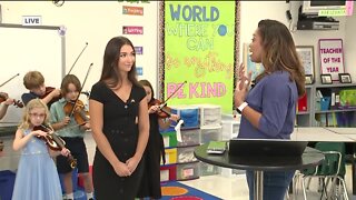 Deiah Riley talks with MacFarlane Park Elementary's new violin teacher