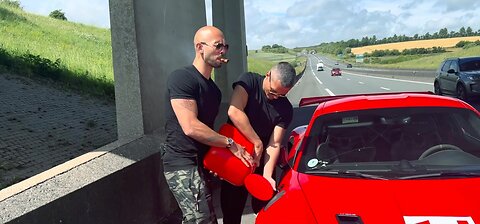 Andrew Tate smoking while adding fuel in his porsche.