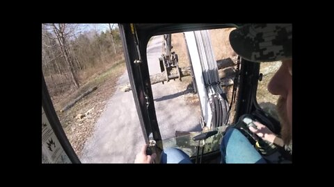 Bobcat mini excavator clearing logs from mile long gravel driveway (Sunday Chores)