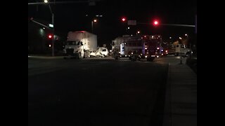 One dead in crash between van and semi-truck in Henderson
