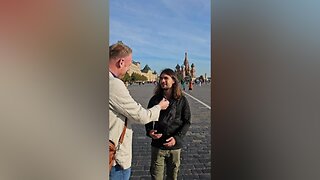 An Irishman interviews a Frenchman at the Russian "Red Square"