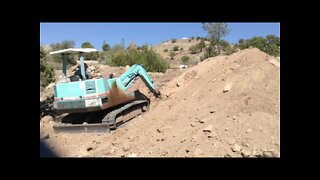 Yanmar Excavator Digging a Culvert