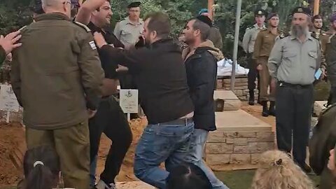 A Brother of Israeli Soldier Who Died in Gaza Attacks Israeli Minister Benny Gantz at His Funeral