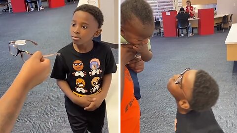 Little brother finds his brother's glasses hilarious