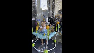 Happy baby playing with bubbles