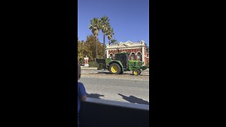 John Deere tractor travels through CBD