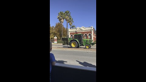 John Deere tractor travels through CBD