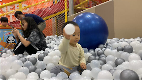Cute baby playing with balls