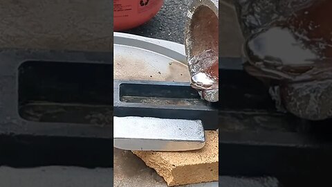 Pouring Molten Aluminum into Ingots