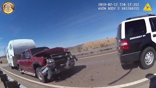 WATCH: Peoria officer clearing hay nearly hit by vehicle