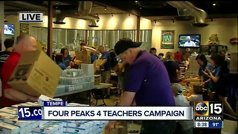 Four Peaks Brewery building boxes of supplies for classrooms