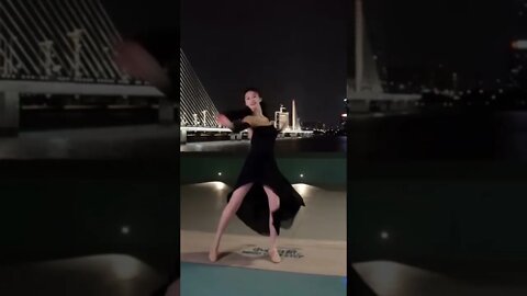 Tall Beautiful Chinese Girl Dances Along The River