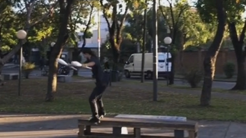 Talented Skateboarder Juggles Pins While Performing Trick