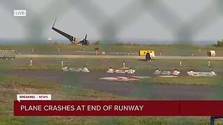 Small plane carrying 3 goes off runway at Albert Whitted Airport, ends up near water