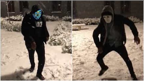 Masked group dance in the snow in England