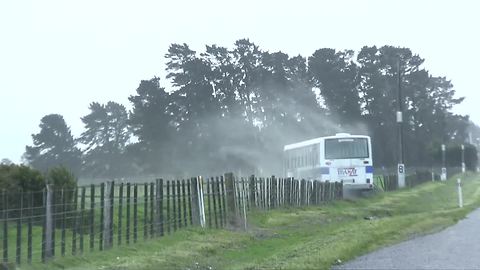 Extreme winds in New Zealand push school bus off road