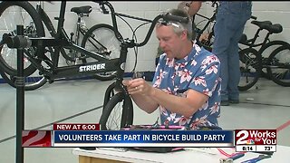 Volunteers take part in bicycle build party