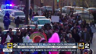 Youth march rallies support for new city fund