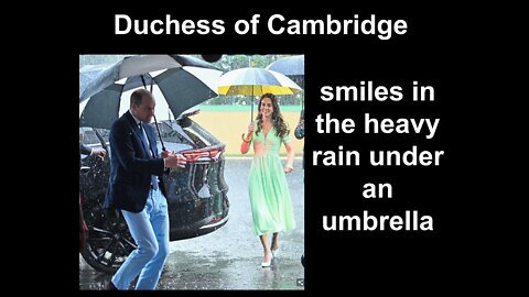 Duchess of Cambridge smiles in the heavy rain