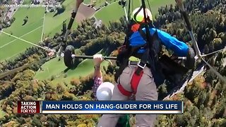 MUST SEE VIDEO: Hang-glider holds on for dear life after pilot forgets to strap him in
