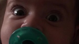 Baby Reacts With Funny Face To Light Turning On And Off