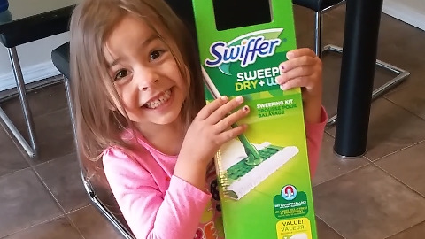 Cute Girl Excited By The Swiffer Cleaner