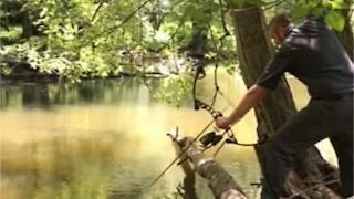 Man narrowly escapes his own arrow!