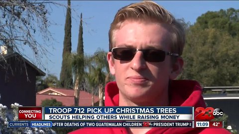 Boy Scout Troop 712 pick up Christmas trees