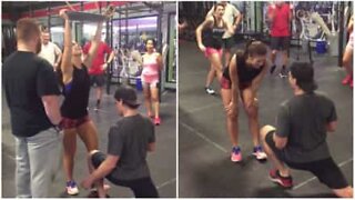 Emotional marriage proposal at the gym