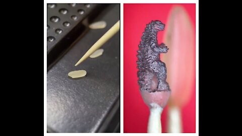 Godzilla carved from a grain of rice
