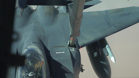 KC-10 Extender refuels F-15E Strike Eagles