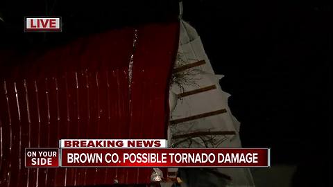 Hamersville storm damage: Roof of old firehouse left dangling from tree
