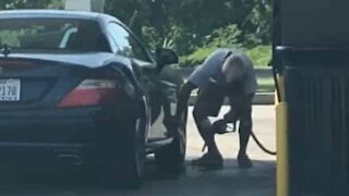 Man cleans car with gasoline