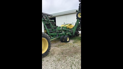 Folding up Big John Deere Air Seeder